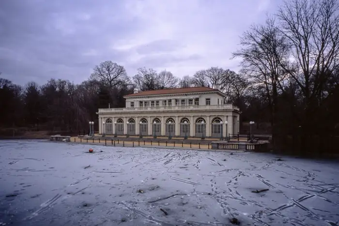 the Prospect Park boathouse with a frozen pond in front of it